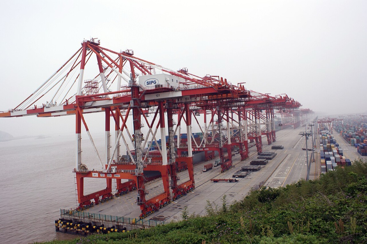 Aerial view of Shanghai Yangshan deep-water port with thousands of stacked containers awaiting export to the United States in the final loading window of 2025